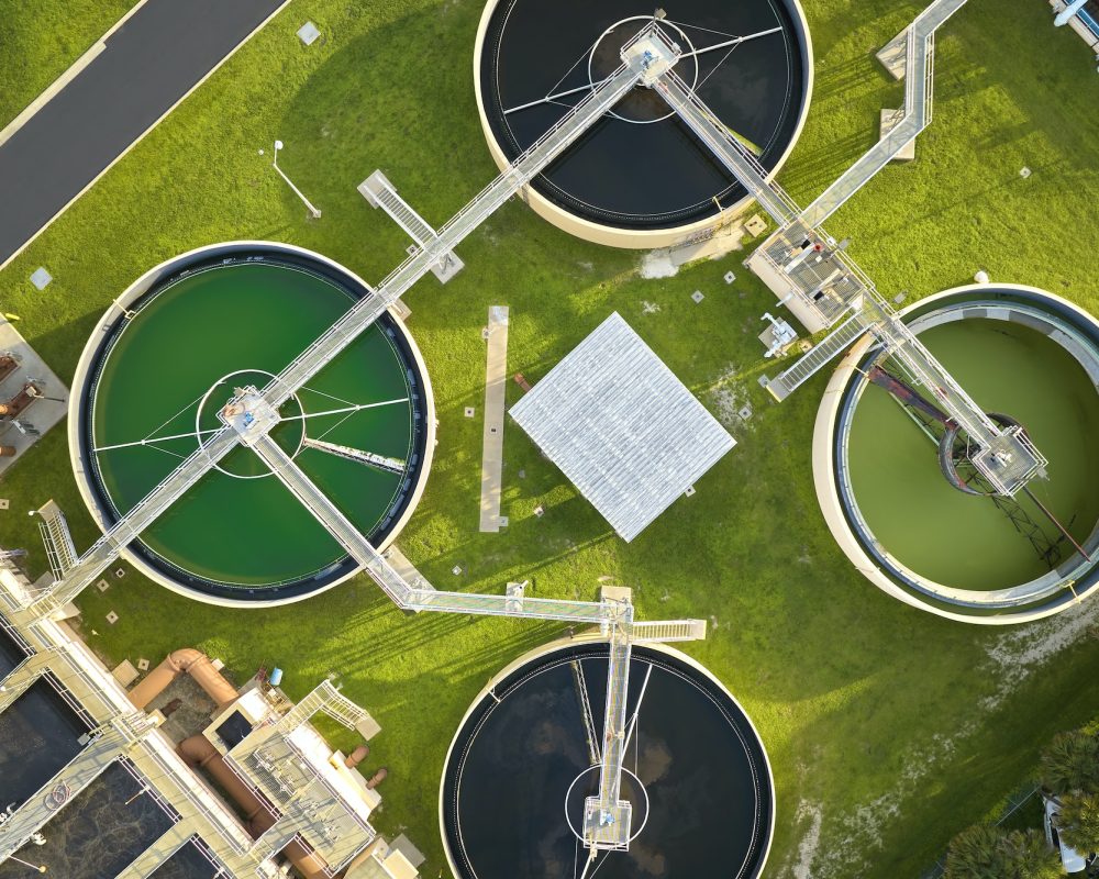 Aerial view of modern water cleaning facility at urban wastewater treatment plant.
